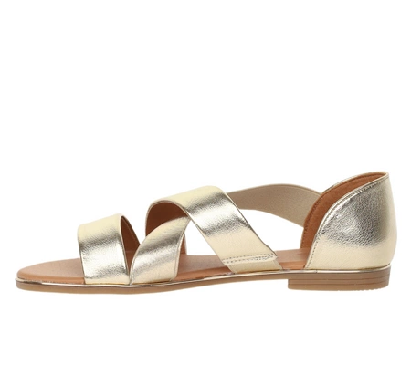 Złote płaskie sandały damskie z gumkami na krzyż i zabudowaną piętą Jezzi