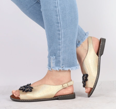 Złote sandały damskie eleganckie na płaskiej podeszwie Jezzi